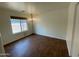 Bedroom featuring wood-look tile flooring and a chandelier at 3229 W Five Mile Peak Dr, San Tan Valley, AZ 85144
