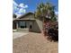 View of the home's exterior and desert landscaping, showcasing some nice plants and a desert landscape at 3229 W Five Mile Peak Dr, San Tan Valley, AZ 85144