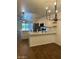 Bright kitchen features a breakfast bar with modern lighting at 3229 W Five Mile Peak Dr, San Tan Valley, AZ 85144