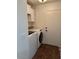 Convenient laundry room includes a modern washer, dryer, and storage shelves at 3229 W Five Mile Peak Dr, San Tan Valley, AZ 85144