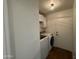 Convenient laundry room with washer, dryer, and extra storage space at 3229 W Five Mile Peak Dr, San Tan Valley, AZ 85144