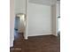 Bright living area with tall ceilings, wood-look floors, arched doorways, and neutral wall paint at 3229 W Five Mile Peak Dr, San Tan Valley, AZ 85144