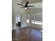 Bright main bedroom with a ceiling fan and bathroom access at 3229 W Five Mile Peak Dr, San Tan Valley, AZ 85144