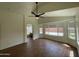 Bright main bedroom with wood-look flooring and a private bathroom at 3229 W Five Mile Peak Dr, San Tan Valley, AZ 85144