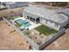 Aerial view of the home featuring a private backyard oasis, including a pool, spa, and desert landscaping at 34047 N 10Th St, Phoenix, AZ 85085