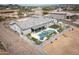 Aerial view of the home showcasing the backyard oasis, including a pool, covered patio, and desert landscaping at 34047 N 10Th St, Phoenix, AZ 85085