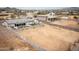 Large desert lot ready for building, showcasing privacy fencing, landscaping potential, and a glimpse of neighboring homes at 34047 N 10Th St, Phoenix, AZ 85085