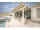Covered patio with ample space for entertaining, views of the pool and desert landscaping at 34047 N 10Th St, Phoenix, AZ 85085