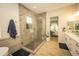 Modern bathroom featuring a glass shower and double vanity sinks, combines style and convenience at 34047 N 10Th St, Phoenix, AZ 85085