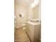 Well-lit bathroom featuring a vanity with modern fixtures, a large mirror, and tile accents at 34047 N 10Th St, Phoenix, AZ 85085