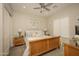 Well-lit bedroom featuring a wooden bed frame, ceiling fan and matching nightstands with carpet floors at 34047 N 10Th St, Phoenix, AZ 85085