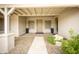 Inviting front porch with decorative plants, neutral paint, and a well-maintained entrance at 34047 N 10Th St, Phoenix, AZ 85085