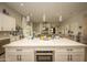 The island, with seating, offers a view of the living area and fireplace at 34047 N 10Th St, Phoenix, AZ 85085