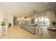 Open-concept living space with tile floors, modern furnishings, and sliding doors to the pool at 34047 N 10Th St, Phoenix, AZ 85085