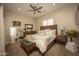 A cozy bedroom with a wooden bed frame, matching nightstands, and decorative accents at 34047 N 10Th St, Phoenix, AZ 85085