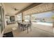 Inviting outdoor living area with dining, a covered patio, and a view of the pool and desert landscape at 34047 N 10Th St, Phoenix, AZ 85085