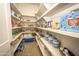 Well-stocked pantry features ample shelving, ideal for organized storage and easy access to goods at 34047 N 10Th St, Phoenix, AZ 85085