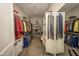 Large walk-in closet offers ample storage with custom shelving, maximizing organization and convenience at 34047 N 10Th St, Phoenix, AZ 85085