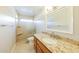 Bathroom featuring granite counters, vanity, and a glass enclosed shower with seat at 3774 W Wood Dr, Phoenix, AZ 85029