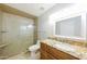 Bathroom featuring granite counters, vanity, and a glass enclosed shower with seat at 3774 W Wood Dr, Phoenix, AZ 85029