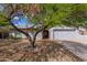 Charming single-story home with a well-manicured front yard and a two-car garage at 3774 W Wood Dr, Phoenix, AZ 85029