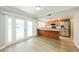 Modern kitchen featuring stainless steel appliances, wooden cabinets, and granite countertops at 3774 W Wood Dr, Phoenix, AZ 85029