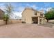 Large backyard showcasing a covered patio and surrounded by stone and gravel at 4106 E Lavender Ln, Phoenix, AZ 85044