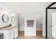 Bright bathroom features double closets, granite countertop, modern sink, and circular mirror at 4106 E Lavender Ln, Phoenix, AZ 85044
