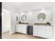 Spacious bathroom features granite countertops, double sinks, round mirrors, and ample lighting at 4106 E Lavender Ln, Phoenix, AZ 85044