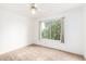 Bedroom featuring natural light, neutral carpet, ceiling fan, and white trim at 4106 E Lavender Ln, Phoenix, AZ 85044