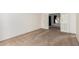 Spacious bedroom with neutral carpet, white walls, and access to an adjacent room through glass doors at 4106 E Lavender Ln, Phoenix, AZ 85044
