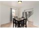 Cozy dining area with a modern table, chairs, and a bright window that provides natural light at 4106 E Lavender Ln, Phoenix, AZ 85044