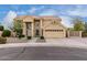 Two-story home featuring a tan exterior, manicured landscaping, and a spacious two-car garage at 4106 E Lavender Ln, Phoenix, AZ 85044
