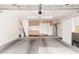Open garage featuring neutral paint, storage, and a large concrete floor at 4106 E Lavender Ln, Phoenix, AZ 85044