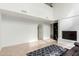 Spacious living room with a fireplace, open shelving, and tile floors at 4106 E Lavender Ln, Phoenix, AZ 85044
