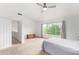 Spacious main bedroom with carpet, a ceiling fan, and bright natural light at 4106 E Lavender Ln, Phoenix, AZ 85044