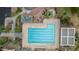 Overhead view of the community pool, complete with lounge areas and lush tropical landscaping at 4106 E Lavender Ln, Phoenix, AZ 85044