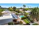 Backyard aerial view showcasing a refreshing pool, solar panels, and beautifully landscaped grounds at 5001 E Redfield Rd, Scottsdale, AZ 85254