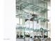 Home wet bar with glass shelves, stemware, chrome faucet, and decorative accents at 5001 E Redfield Rd, Scottsdale, AZ 85254