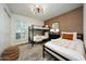 Bedroom with bunk beds, twin beds, and a neutral-colored rug, perfect for guests or children at 5001 E Redfield Rd, Scottsdale, AZ 85254