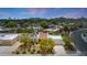 Inviting home with desert landscaping, a private drive and a sparkling pool beyond the main house at 5001 E Redfield Rd, Scottsdale, AZ 85254
