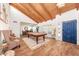 Spacious living room featuring a pool table, vaulted wood ceilings, and stylish decor at 5001 E Redfield Rd, Scottsdale, AZ 85254
