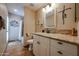 Renovated bathroom features granite counters, updated fixtures, and a tiled shower at 5120 E Janice Way, Scottsdale, AZ 85254