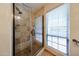 Bathroom featuring glass shower with tile surround and window with privacy blinds at 5120 E Janice Way, Scottsdale, AZ 85254