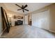 Neutral bedroom boasts large windows, ceiling fan, double door closet, and a piano at 5120 E Janice Way, Scottsdale, AZ 85254