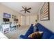 Bedroom with a blue sofa and ceiling fan at 5120 E Janice Way, Scottsdale, AZ 85254
