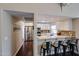 Modern kitchen with stainless steel appliances, granite countertops, breakfast bar, and ample cabinet space at 5120 E Janice Way, Scottsdale, AZ 85254
