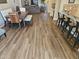 Open concept living room features wood-look flooring, eat in kitchen, and dining space at 5120 E Janice Way, Scottsdale, AZ 85254