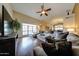 Inviting living room with vaulted ceilings, featuring hardwood floors, large windows, and a cozy seating area at 5120 E Janice Way, Scottsdale, AZ 85254