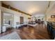 Open-concept living room with hardwood floors, high ceilings, stylish furnishings, and natural light at 5120 E Janice Way, Scottsdale, AZ 85254